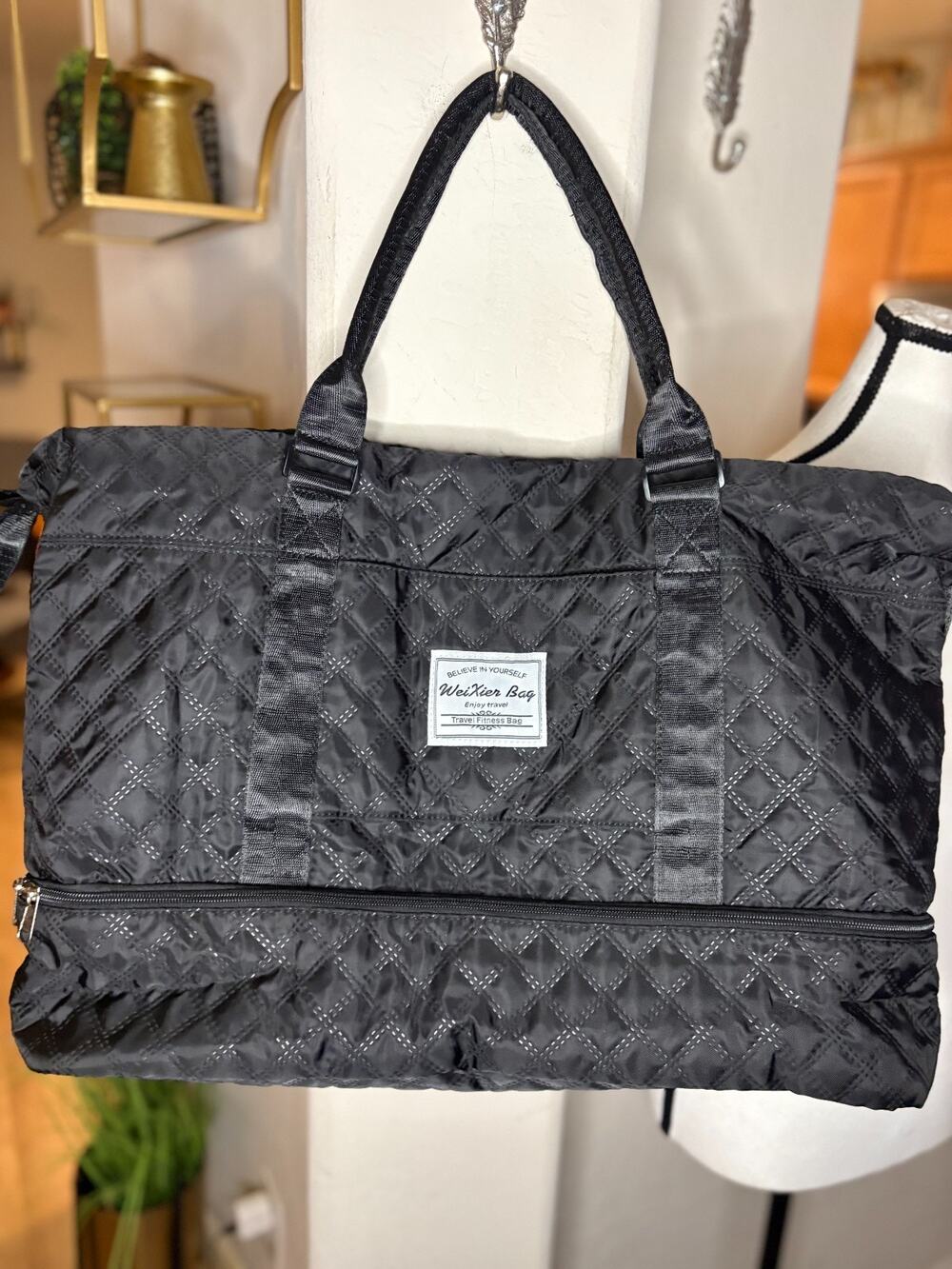 black quilted duffel bag by WeiXier